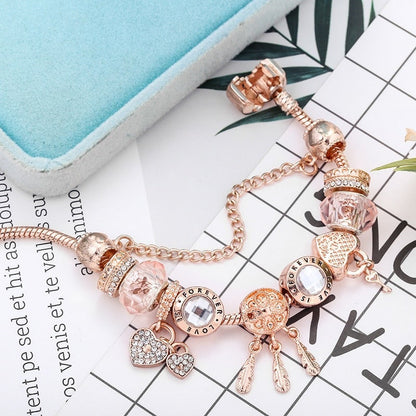 Rosé drømfangerarmbånd med charms i sterling sølv inkluderet