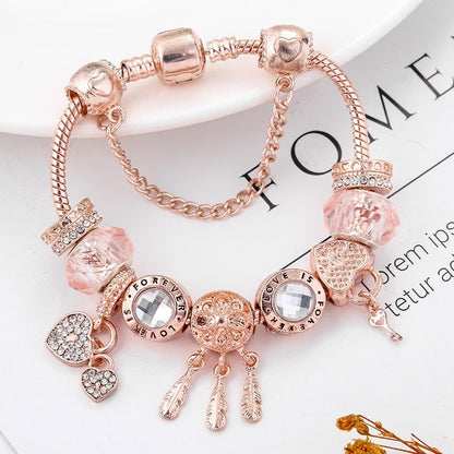 Rosé drømfangerarmbånd med charms i sterling sølv inkluderet