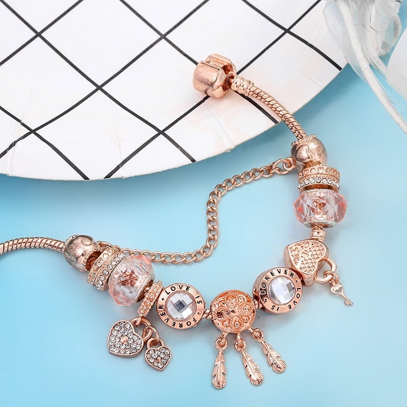 Rosé drømfangerarmbånd med charms i sterling sølv inkluderet